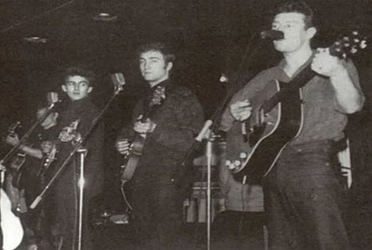 Photo of Tony Sheridan performing onstage with the Beat Brothers (a.k.a. the Beatles). Original source: https://rocknrollunravelled.com/tony-sheridan-and-the-beat-brothers/.